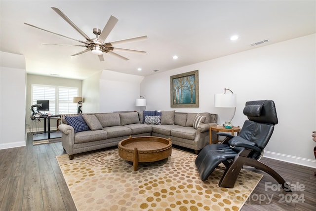 living room with hardwood / wood-style flooring and ceiling fan