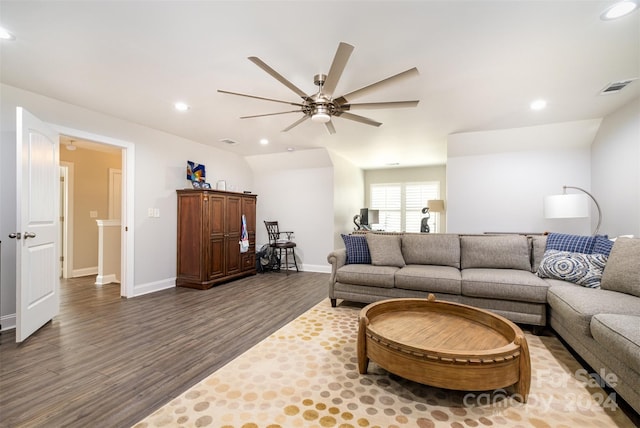 living room with vaulted ceiling, hardwood / wood-style flooring, and ceiling fan