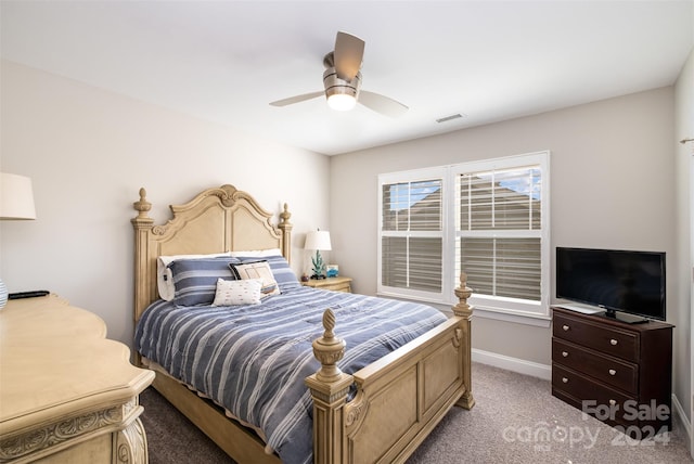 bedroom featuring ceiling fan and carpet