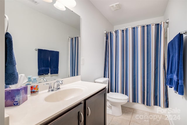 bathroom featuring walk in shower, tile patterned floors, vanity, and toilet