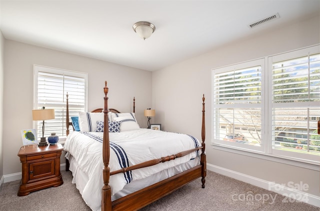 bedroom with light carpet