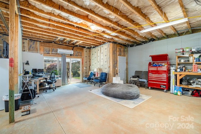 basement featuring a wall unit AC