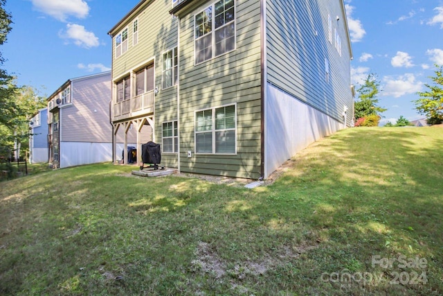 rear view of house with a lawn