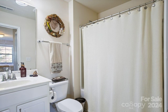 full bathroom featuring toilet, vanity, and shower / bathtub combination with curtain