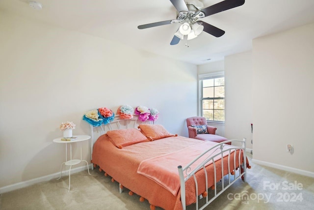 bedroom featuring ceiling fan and carpet floors