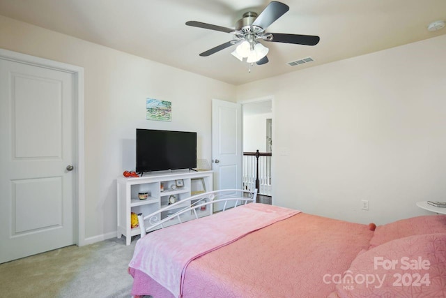 bedroom featuring ceiling fan and light colored carpet