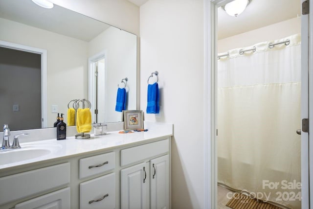 bathroom with vanity and a shower with shower curtain