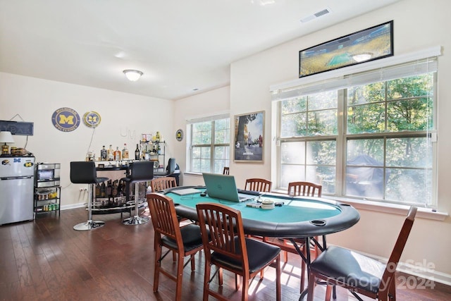 dining area with dark hardwood / wood-style flooring