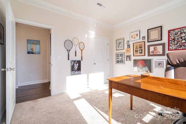 office area featuring dark carpet and ornamental molding