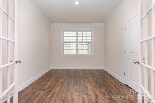 unfurnished room with ornamental molding, dark wood-type flooring, and french doors