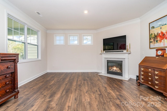 interior space with dark hardwood / wood-style flooring and ornamental molding