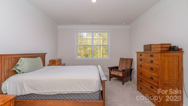 carpeted bedroom featuring crown molding