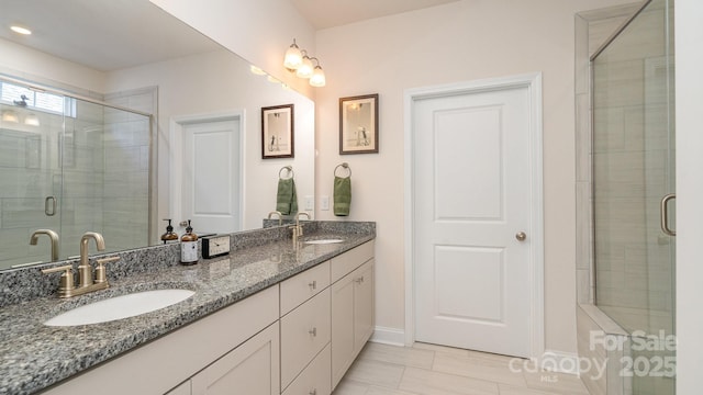 bathroom with vanity, tile patterned floors, and a shower with door