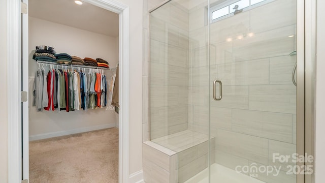 bathroom with a shower with shower door