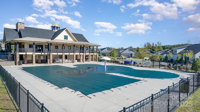 view of swimming pool featuring a patio area