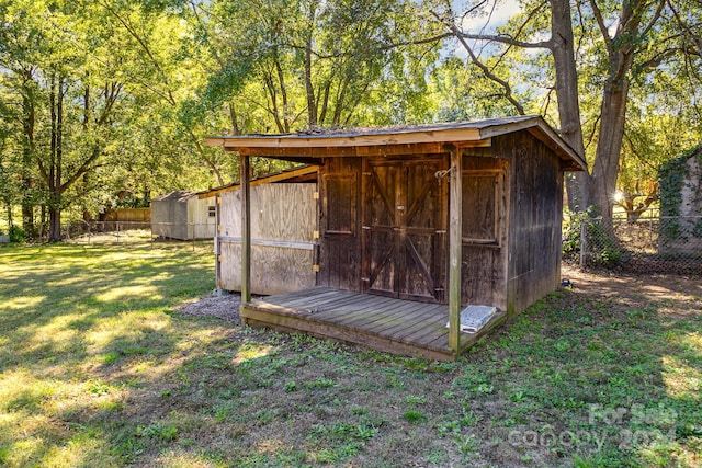 view of outbuilding with a yard