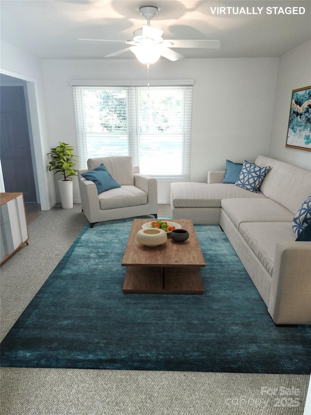 carpeted living area with ceiling fan