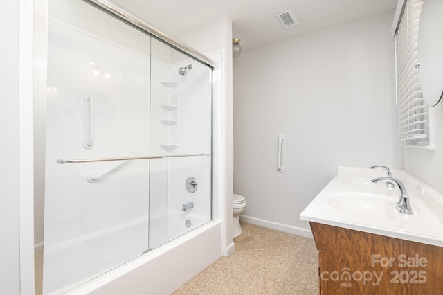 bathroom with shower / bath combination with glass door, double vanity, visible vents, toilet, and baseboards