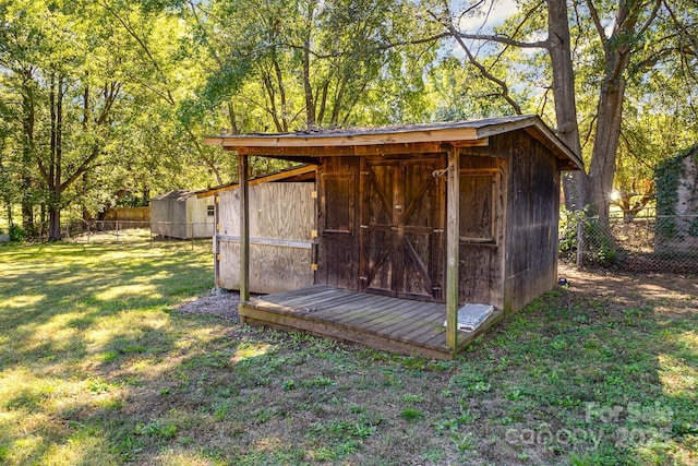 view of shed with fence