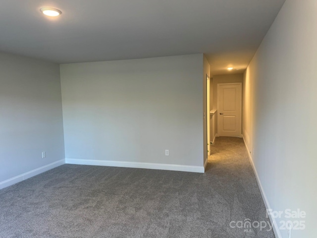 empty room with dark carpet