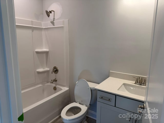 full bathroom featuring bathing tub / shower combination, vanity, and toilet