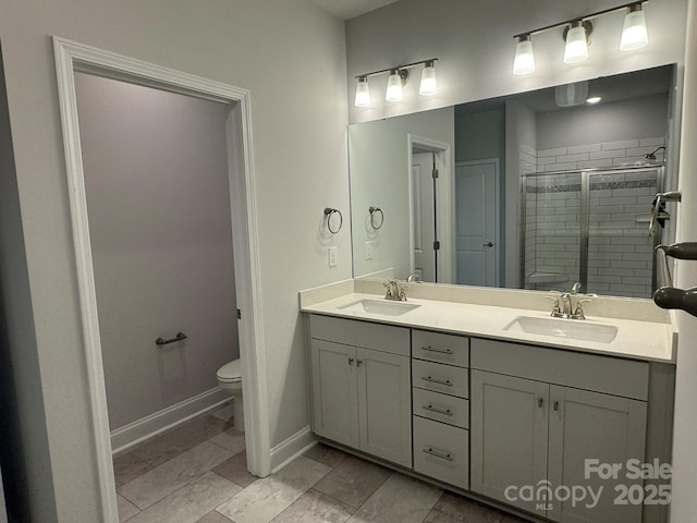 bathroom with walk in shower, tile patterned floors, vanity, and toilet