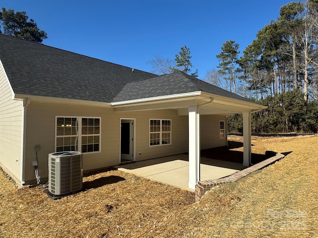 back of house with cooling unit and a patio area