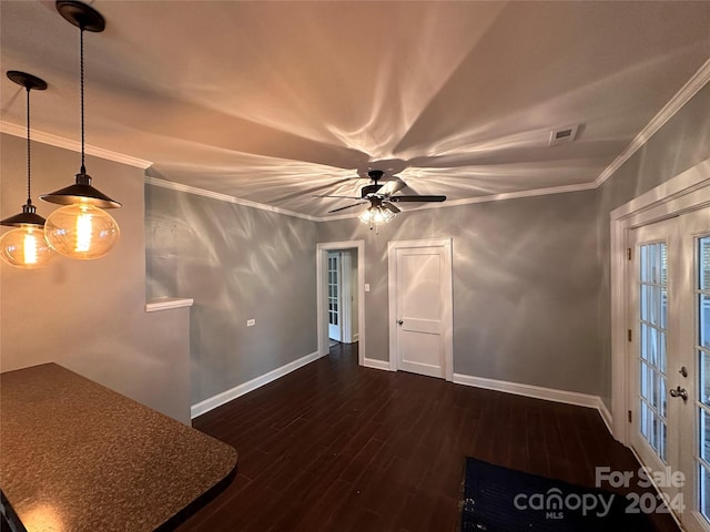 unfurnished room with crown molding, ceiling fan, french doors, and dark hardwood / wood-style flooring