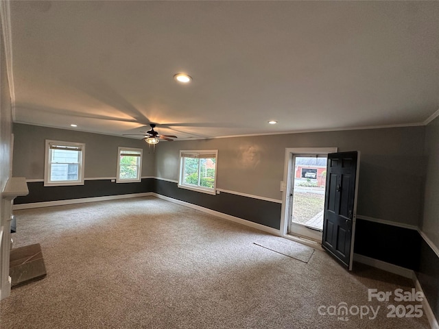 carpeted spare room with recessed lighting, baseboards, ceiling fan, and crown molding