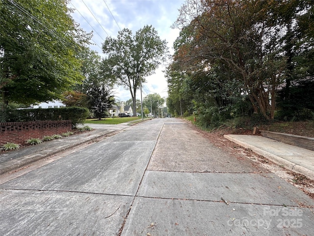 view of road featuring curbs and sidewalks