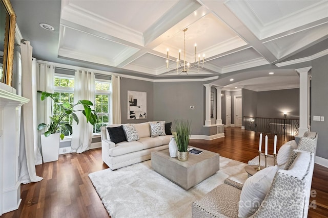 living room with coffered ceiling, ornamental molding, hardwood / wood-style floors, and ornate columns