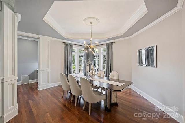 dining room with a notable chandelier, a raised ceiling, crown molding, and dark wood-type flooring