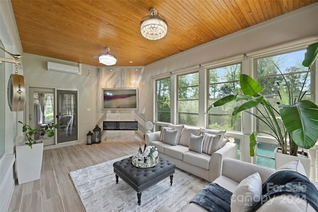 living room featuring light hardwood / wood-style flooring, wood ceiling, a fireplace, and a wall unit AC