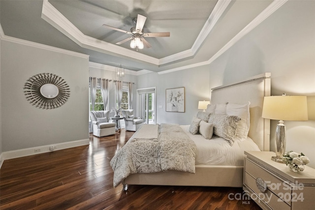 bedroom featuring a tray ceiling, ceiling fan, dark hardwood / wood-style floors, and crown molding