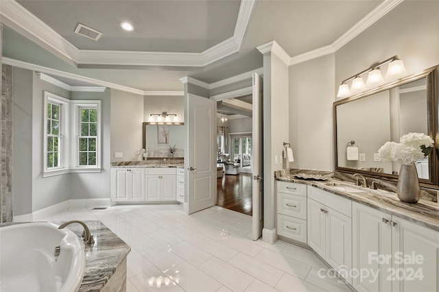 bathroom featuring crown molding, a bathing tub, vanity, and hardwood / wood-style flooring