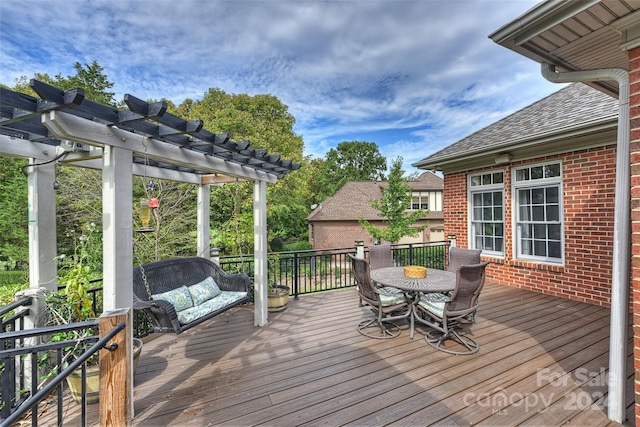 wooden terrace with a pergola