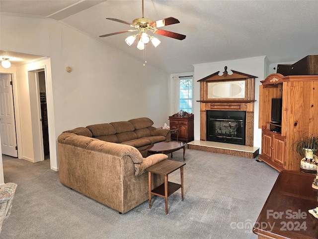 carpeted living room featuring ceiling fan and lofted ceiling