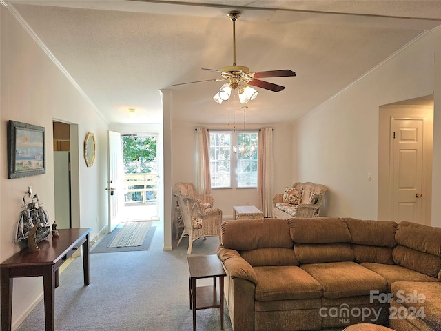 carpeted living room with a textured ceiling, lofted ceiling, ornamental molding, and ceiling fan