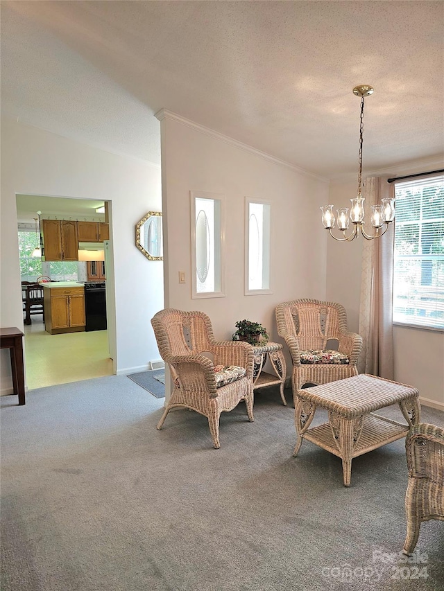 sitting room featuring a notable chandelier, light colored carpet, a textured ceiling, and ornamental molding