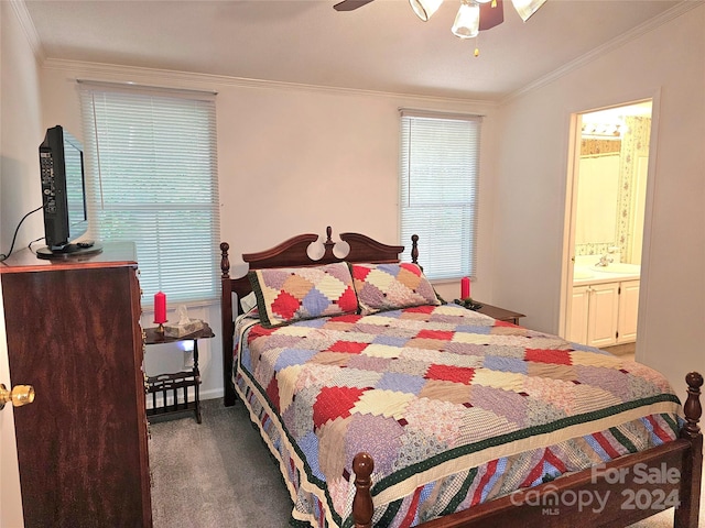 carpeted bedroom featuring ornamental molding, ceiling fan, and ensuite bathroom