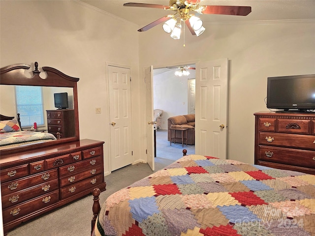 carpeted bedroom featuring ceiling fan and ornamental molding