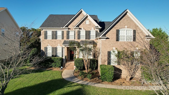 view of front of house with a front lawn