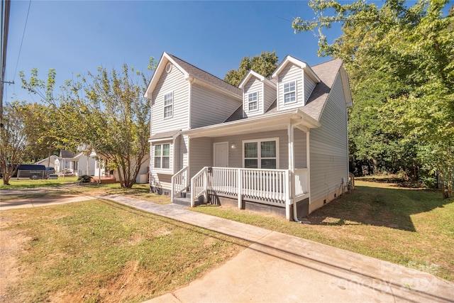 view of front of home with a front lawn and covered porch