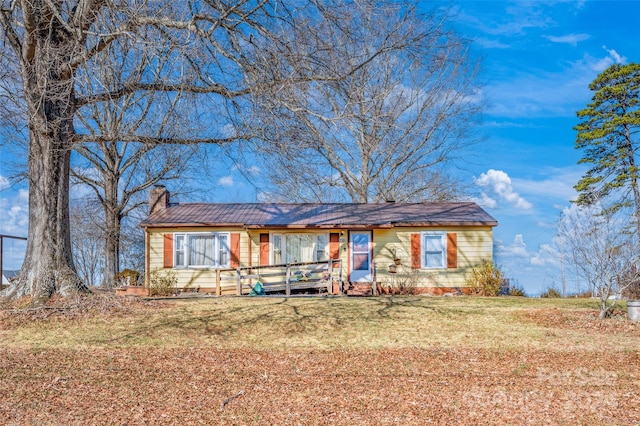 ranch-style home with a front lawn