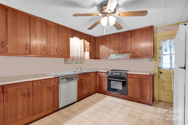 kitchen featuring ceiling fan, sink, and black appliances