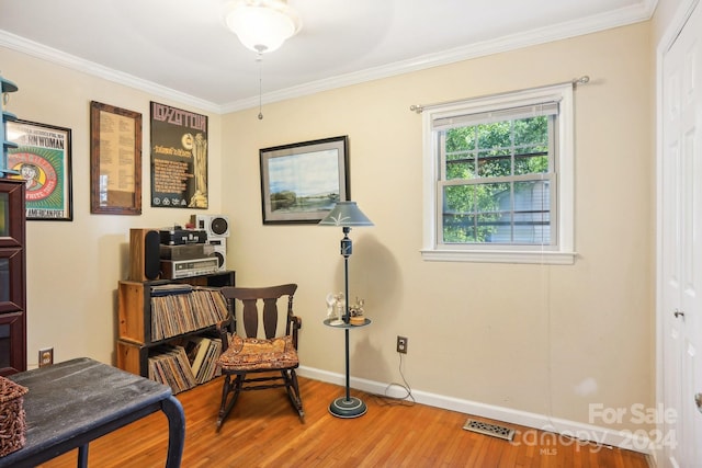 office area with ornamental molding and hardwood / wood-style flooring