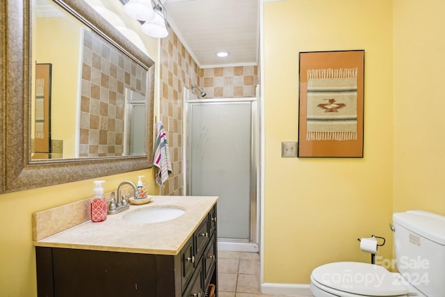 bathroom featuring a shower with door, vanity, toilet, and tile patterned flooring