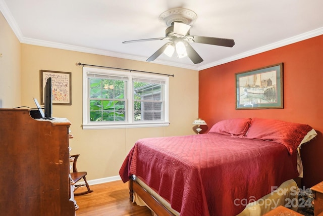 bedroom with ornamental molding, light wood-type flooring, and ceiling fan