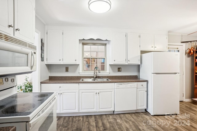 kitchen featuring ornamental molding, sink, white cabinets, white appliances, and dark hardwood / wood-style flooring