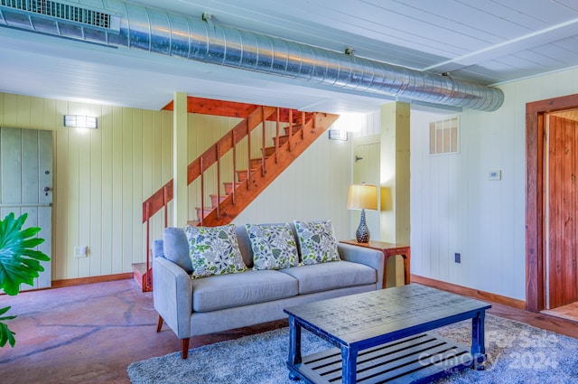 living room with wood walls